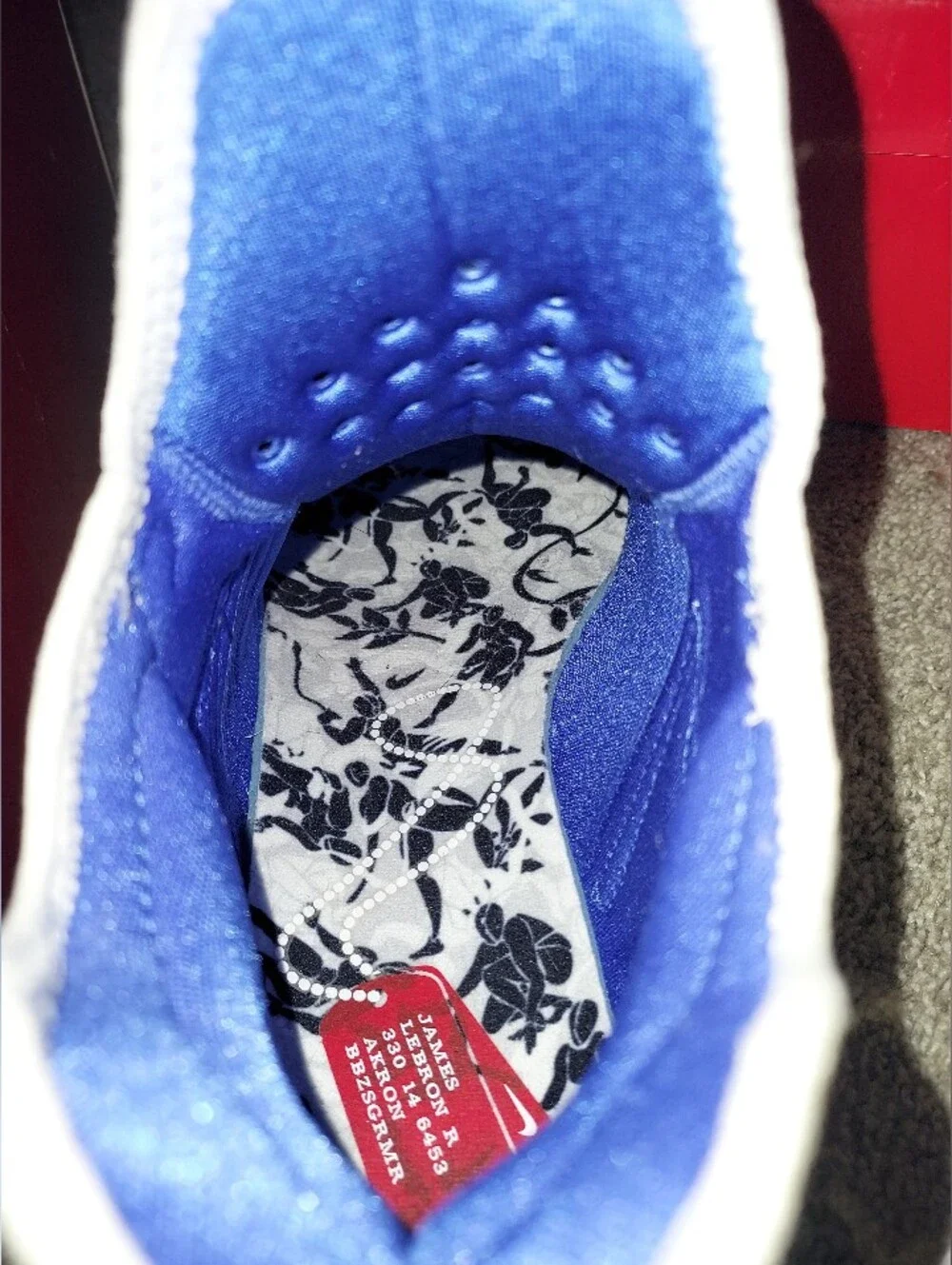 Nike Men’s White Floral Training Shoes with Black Print and Blue Details